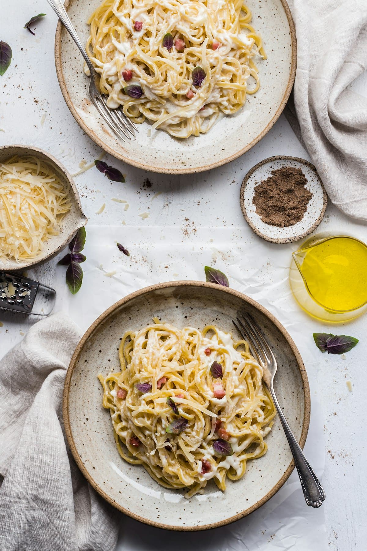 Illustrative plate of pasta with herbs and a fork